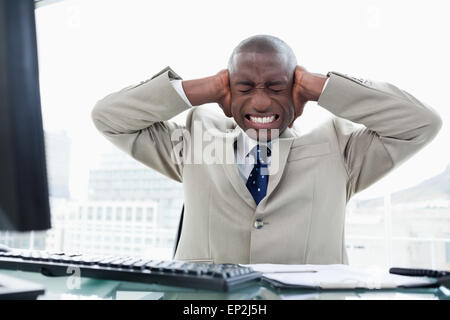 Entrepreneur having a headache while working with a computer Stock Photo