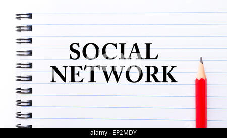 Social Network Text written on notebook page, red pencil on the right. Motivational Concept image Stock Photo