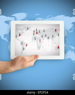 Hand showing a tablet PC displaying world map Stock Photo