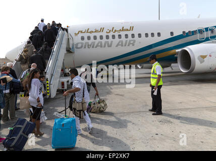 Passengers boarding Oman Airways plane, Seeb International Airport, Muscat, Oman Stock Photo