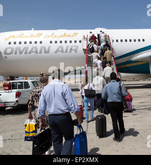 Passengers boarding Oman Airways plane, Seeb International Airport, Muscat, Oman Stock Photo