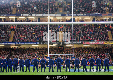 Wales players in track suits face towards the All Blacks haka, a maori traditional war dance performed prior to All Black matche Stock Photo