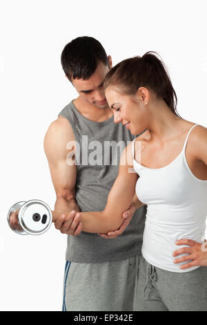 With help of gym equipment. Two women in sportive wear and with slim bodies  have fitness yoga day indoors together Stock Photo - Alamy