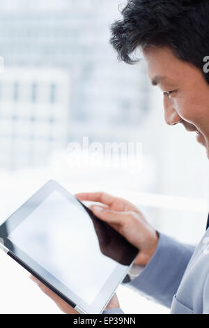 Portrait of a office worker using a tablet computer Stock Photo