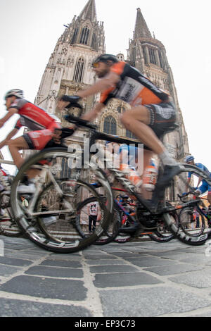 Regensburg, Germany. 13th May, 2015. Riders start for the first stage of the Tour of Bavaria cycling tour, in front of Regensburg Cathedral in Regensburg, Germany, 13 May 2015. Photo: Armin Weigel/dpa/Alamy Live News Stock Photo