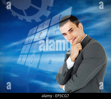 Businessman standing against blue background Stock Photo