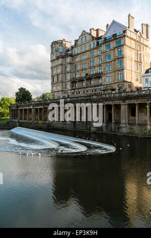 View to old Empire Hotel victorian building from across river avon Bath Somerset