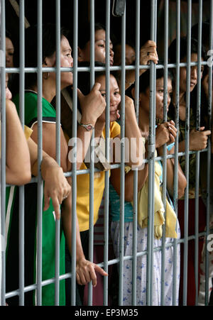 Convicted women behind bars in a communal cell in the Angeles District Jail, The Phillipines Stock Photo