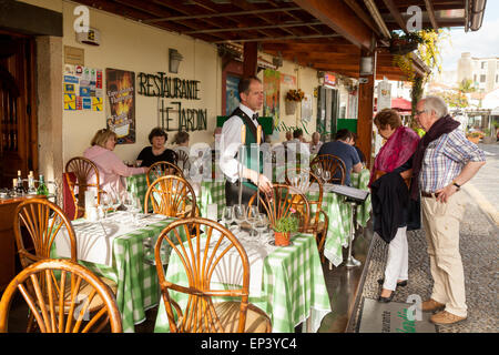 madeira restaurant; Waiter and customers at a restaurant in Funchal old town ( Zona Velha ), Funchal Madeira, Europe Stock Photo