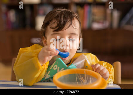Baby boy eating Stock Photo