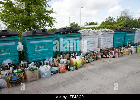 Glass recycling bins which are overfull await collection in the Winnall area of Winchester Hampshire UK Stock Photo