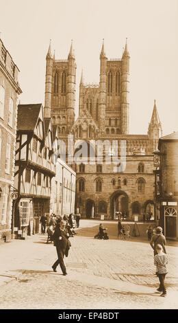 Lincoln, UK - April 9, 2015: Tourists head towards the Lincoln Cathedral, major landmark and the third largest cathedral the UK Stock Photo