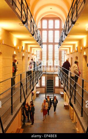 Lincoln, UK - April 9, 2015: Tourists visit medieval prison inside Lincoln Castle Stock Photo