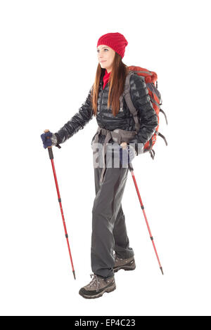 Beautiful young female hiker isolated on white background, standing in full length in outdoor hiking outfit. Stock Photo