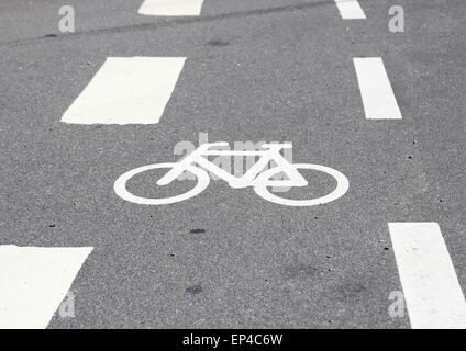 Horizontal bicycle sign on asphalt with white stripes Stock Photo