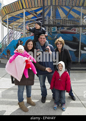 Happy family enjoys outing at Coney Island in Brooklyn, NY. Stock Photo