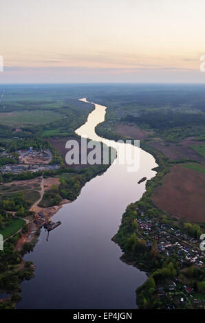 Evening village, roads and river aerial view. Stock Photo