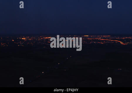 Night town lights, roads and houses aerial view. Stock Photo