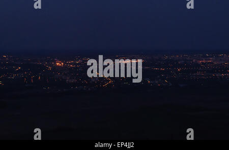 Night town lights, houses and roads aerial view. Stock Photo