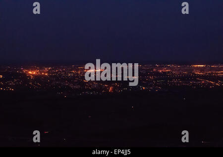 Night town lights, houses and roads aerial view. Stock Photo