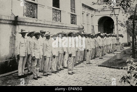 Insurgent soldiers being clothed in new uniforms on inspection during Philippine American War 1898 - 1900 Stock Photo