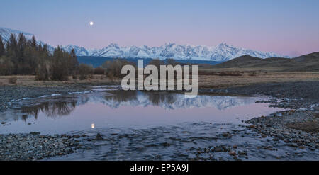 Moon over the Kurai Steppe. The North Chuya Range. Altai. Siberia. Russia Stock Photo