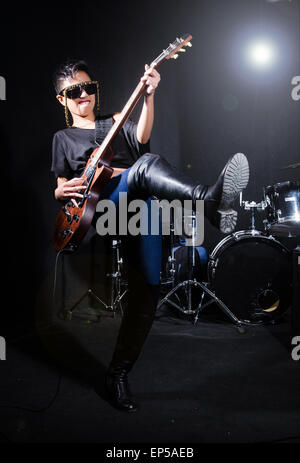 african american rocker with electric guitar showing rock signs ...