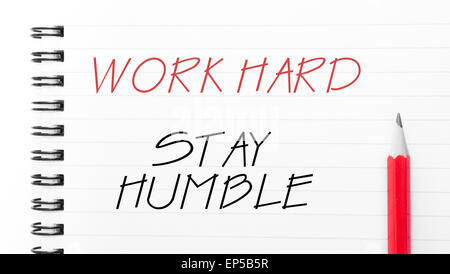 Work Hard Stay Humble Text written on notebook page, red pencil on the right. Motivational Concept image Stock Photo