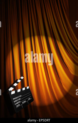 Movie clapper board against curtain Stock Photo