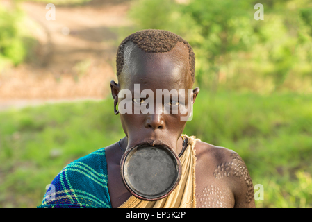 Woman from the African tribe Surma with big lip plate. Stock Photo