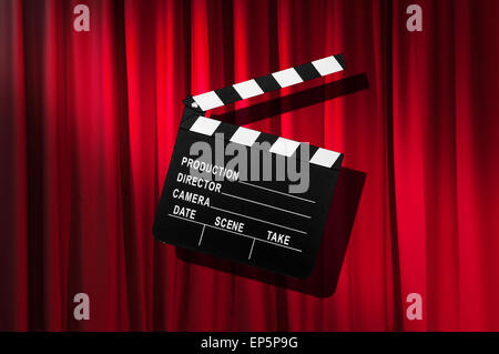 Movie clapper board against curtain Stock Photo