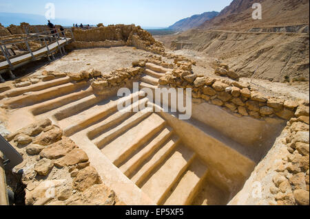 QUMRAN, ISRAEL - OCT 15, 2014: Tourists are visiting the excavations and ruins of Qumran in Israel close to the Dead Sea Stock Photo