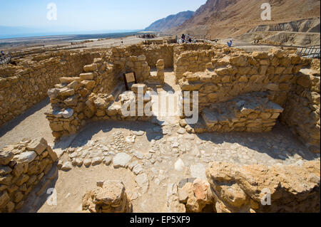 QUMRAN, ISRAEL - OCT 15, 2014: Tourists are visiting the excavations and ruins of Qumran in Israel close to the Dead Sea Stock Photo