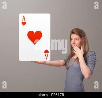 Beautifu woman holding a red heart ace Stock Photo