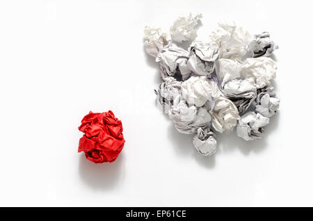 white crumpled paper ball and different red crumpled paper ball on a white background Stock Photo