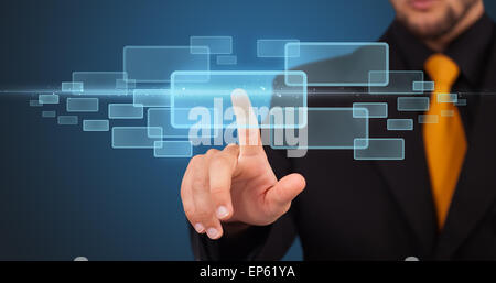 Businessman pressing high tech type of modern buttons Stock Photo