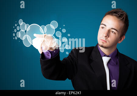 Businessman pressing high tech type of modern buttons Stock Photo