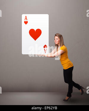 Beautifu woman holding a red heart ace Stock Photo