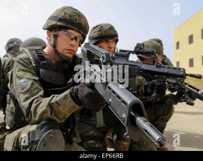 Madrid, Spain. 13th May, 2015. A Spanish soldier from the Brigada Paracaidista during room cleaning training in joint exercise Operation Skyfall May 13, 2015 in Madrid, Spain. Stock Photo