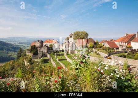 Picturesque hilltop village with garden flowers in foreground in Chateau Chalon, Jura, Franche-Comte, France, Europe. Stock Photo