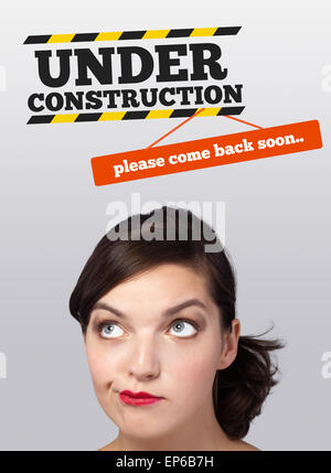 Young girl looking at contruction icons Stock Photo