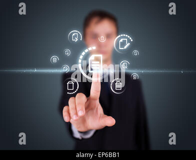 Businessman pressing virtual media type of buttons Stock Photo