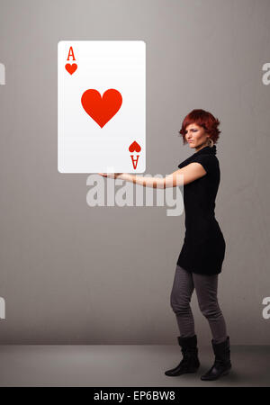 Beautifu woman holding a red heart ace Stock Photo