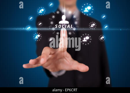 Businessman pressing modern social type of icons Stock Photo