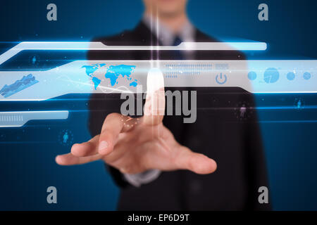 Businessman pressing high tech type of modern buttons Stock Photo