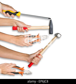 Peoples hands holding tools Stock Photo