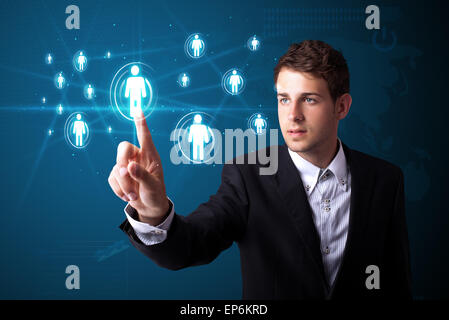 Businessman pressing modern social type of icons Stock Photo
