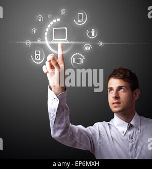 Businessman pressing virtual media type of buttons Stock Photo