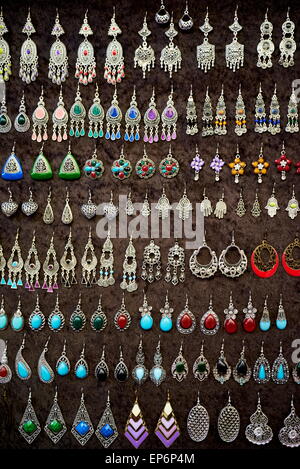 Silver and brass earrings and pendants in a souvenir shop. Morocco Stock Photo