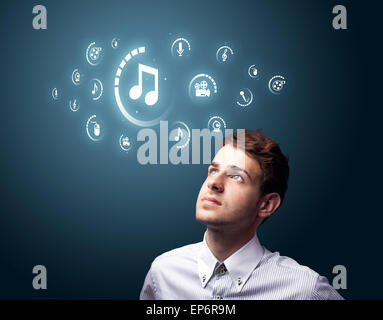 Businessman pressing virtual media type of buttons Stock Photo